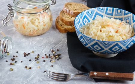 Sauerkraut in a plate on a concrete background. the composition of the feast with sauerkraut.の写真素材