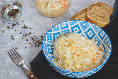 Sauerkraut in a plate on a concrete background. the composition of the feast with sauerkraut.の写真素材