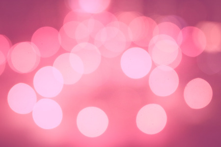 Trending photography on the theme of actual colors for this season-a shade of orange. Blurred abstract orange background with beautiful bokeh effect.の写真素材