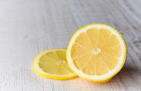 cut lemon on wooden table large plan. horizontal view. citrus fruit.の写真素材