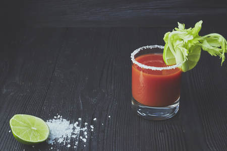Homemade Bacon Spicy Vodka Bloody Mary with Tomatos, Olive and Celeryの写真素材