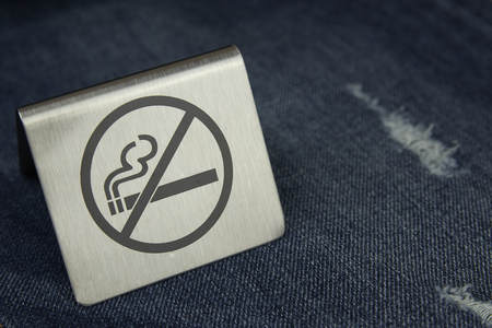 No smoking sign on wood table in the garden at hotel.の写真素材