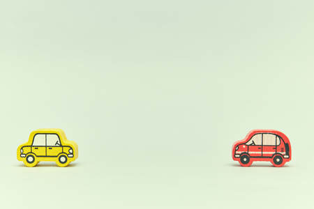 wooden retro typewriter toy on a light background. group of cars with empty space. close-up. educational toys for children.の写真素材