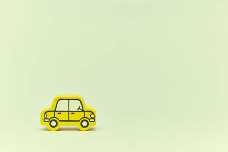 wooden retro typewriter toy on a light background. group of cars with empty space. close-up....