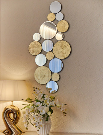 interior room lamp vase with flowers and a decorative mirror on a lightの写真素材