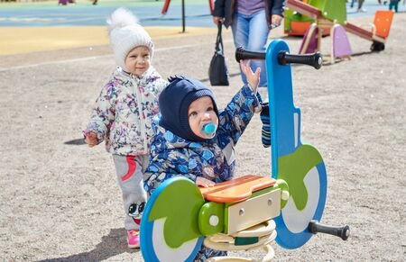 Small children play on the playground. child development. childrens games. entertainment for...