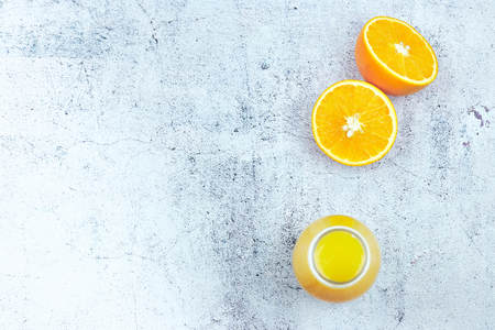 Cold refreshing drink with blood orange slices in a glass on a white concrete background. Top view, flat lay, copy space.の写真素材