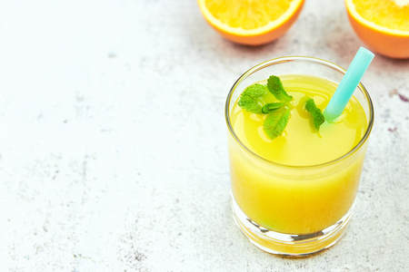 Still Life Glass of Fresh Orange Juice on concrete background with filter.の写真素材