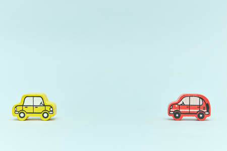 wooden retro typewriter toy on a light background. group of cars with empty space. close-up. educational toys for children.の写真素材