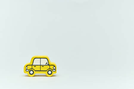 wooden retro typewriter toy on a light background. group of cars with empty space. close-up. educational toys for children.の写真素材
