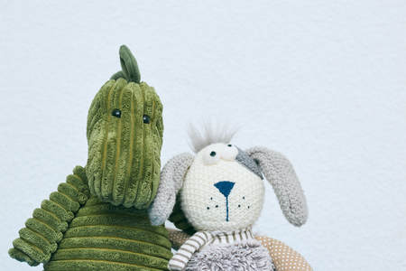 Children's toy plush rabbit isolated on a light background. head of a rabbit close up.の写真素材