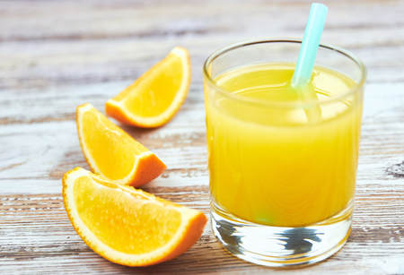 Still Life Glass of Fresh Orange Juice on concrete background with filter.の写真素材