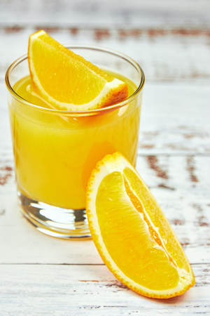 Still Life Glass of Fresh Orange Juice on concrete background with filter.の写真素材