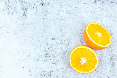Orange slices on dark concrete background. Copy space for text. Selective focus. Square crop.の写真素材