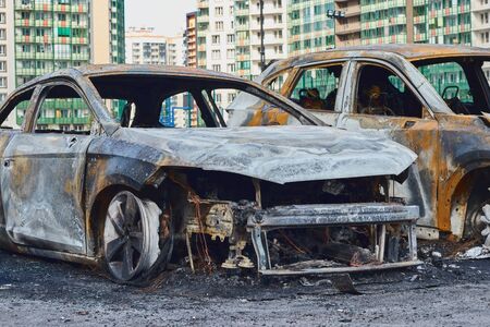 partially burned down car after the fire, parts of body the burned handles of doors and the burst glasses, picture not from pleasant, the insured car after the fireの写真素材