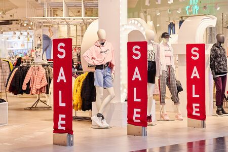 50 discount on advertising layout above the clothing line in a shopping department store for shops, business fashion and advertising conceptsの写真素材