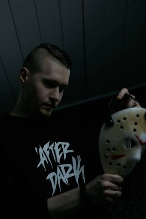 Miami, Florida USA - May 3, 2019. Friday 13th hockey mask of Jason Voorhees. Halloween concept. day of death. man in a jason mask on a black background.のeditorial素材