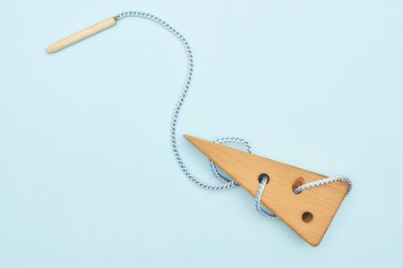 Children educational toy in the form of cheese on a blue