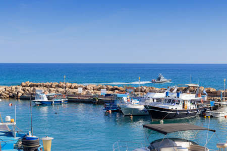 Cyprus Protoras October 11, 2021. different types of yachts and boats on the dock in the bay in clear weather in Cyprus. concept of sea transport.のeditorial素材