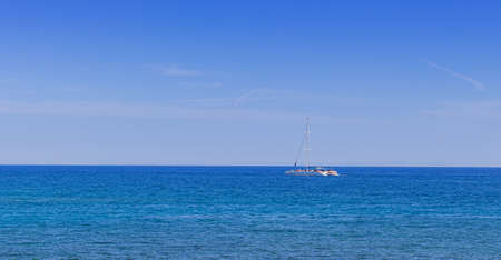 Cyprus Protoras October 11, 2021. White yacht in the blue sea in clear weather. concept of sport and tourism by sea.のeditorial素材