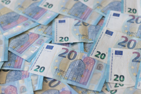 Close-up of 20 euro banknotes. Background of euro currency banknotes. Background of European paper money with 20 euro notes. A lot of money top viewの写真素材