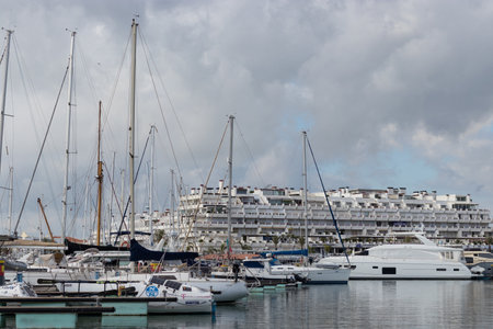 Portugal, Vilamoura, 02.01.2023. Marina de Vilamoura. Yachts standing at the pier on a cloudy day. Expensive yachts.のeditorial素材