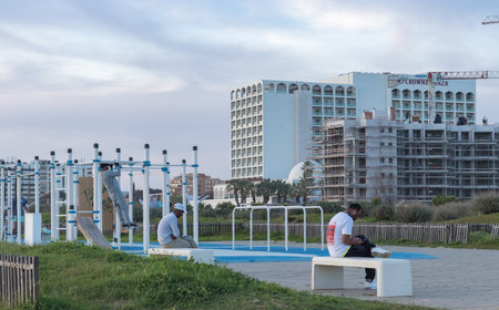 Portugal, Vilamoura, 02.01.2023. Outdoor sports field with multipurpose equipment in an outdoor park, black men playing sports, sports equipment for a healthy lifestyle in an outdoor park area,のeditorial素材
