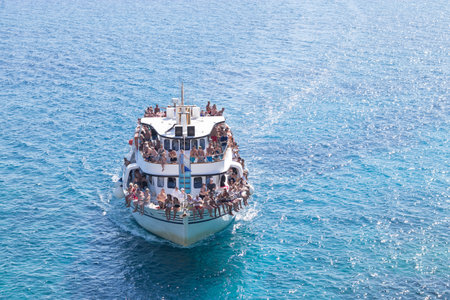Portugal, Vilamoura, 02.01.2023. ferry with tourists in the ocean. tourist ferry with people. travel concept.のeditorial素材