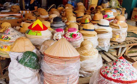 Traditional conical hats display in the marketの写真素材