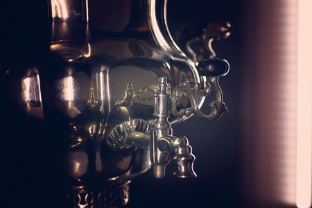 Russian samovar, device for heating water, light from the window.の写真素材