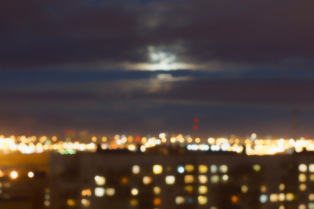 The lights of the city and the sky lit by the moon, a blurry image, the Bokeh effect,の写真素材