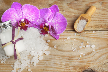 Spa set with body lotion and bath salts white, bright orchid flowers.の写真素材