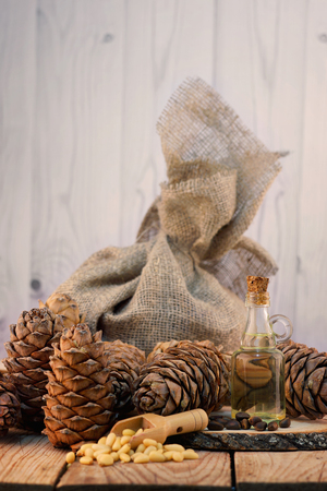 Still life on a table with cedar cones and nutsの写真素材