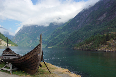 Viking ship on the shore of the fjord in Norwayの写真素材