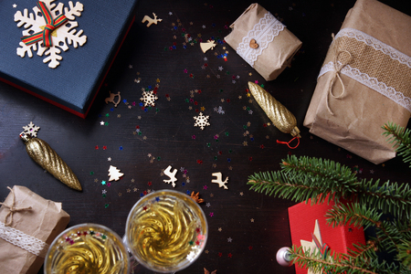 Layout on the table with New Year and Christmas gifts, Christmas tree and toysの写真素材