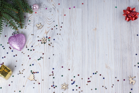 Christmas concept - christmas presents and pink heart on evergreen tree branches with copy space.の写真素材