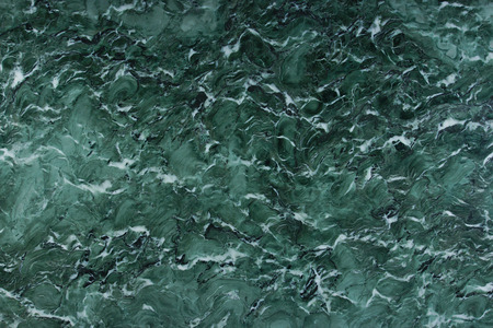 Texture of natural green stone with white pattern Verde Venezia.の写真素材
