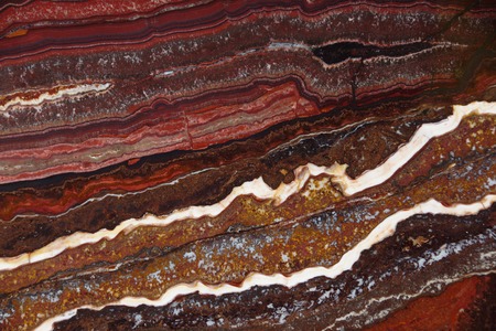 The structure of Onyx, a bright red color with dark streaks and waves, is called Onyx Fantastico.