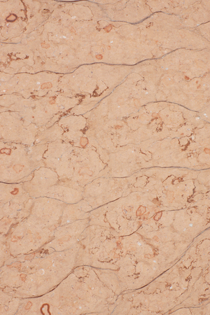 Pink stone with cracks and specks, called Perlino Rosato.の写真素材