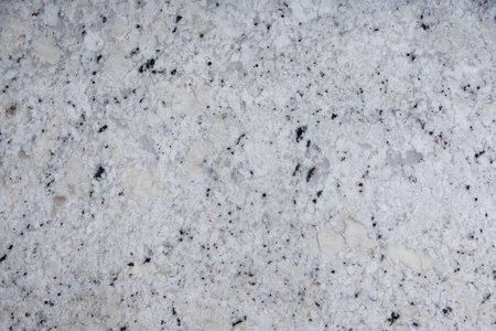 Background natural stone of white color with dark specks, called granite Fantastic White.の写真素材