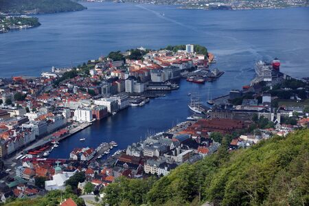 Travel to Norway, top view on Bergen with red roofs and fjord.の写真素材