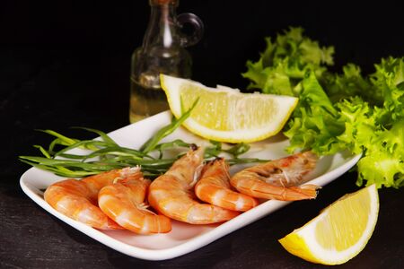 Shrimps lie next to other ingredients before cookingの写真素材