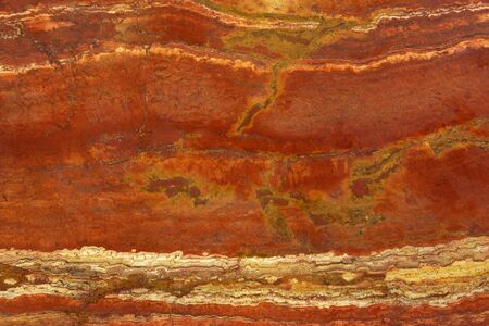 Natural stone in the colors of a lush lava with a white vein called Travertin Rosso.の写真素材