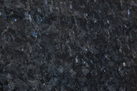 Background from gray granite with blue sparkles, this natural stone is called Blue Pearl.の写真素材