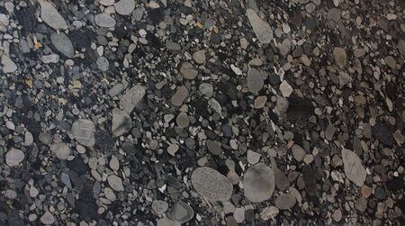 Natural granite with pebbles of black and gray shades of color frozen in it is called Nero Marinace.の写真素材