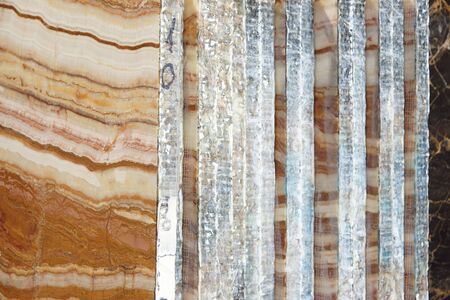 A pile of sawn slabs of natural stone is in the warehouse, a beautiful stone with stripes is called...