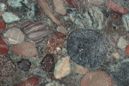 Aquarius granite with a frozen unique pattern of many colorful pebbles.