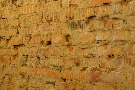 Background loft of a curve red brickwork with old cement perspective.の写真素材