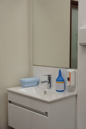 Sink for washing hands and disinfectants in a medical office.の写真素材