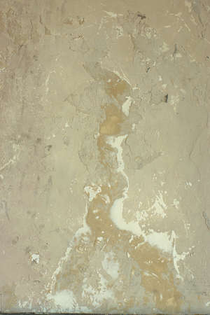 Old ragged wall of beige color, excellent photophone or background.の写真素材